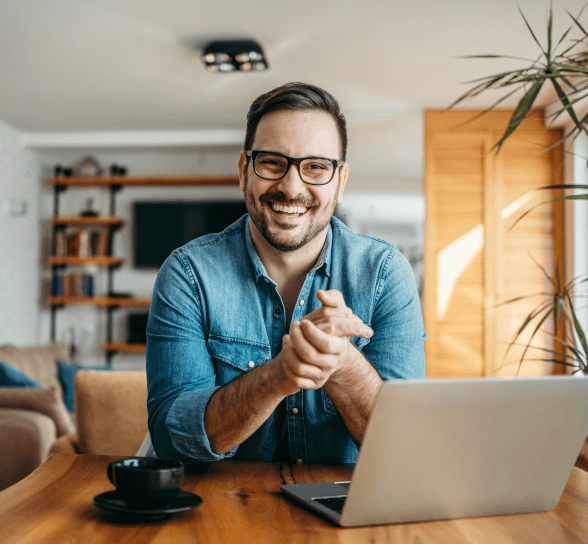 Man smiling with laptop